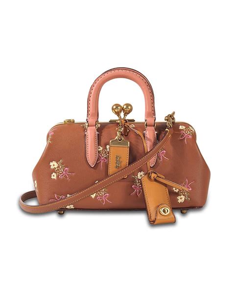 coach floral bow print|More.